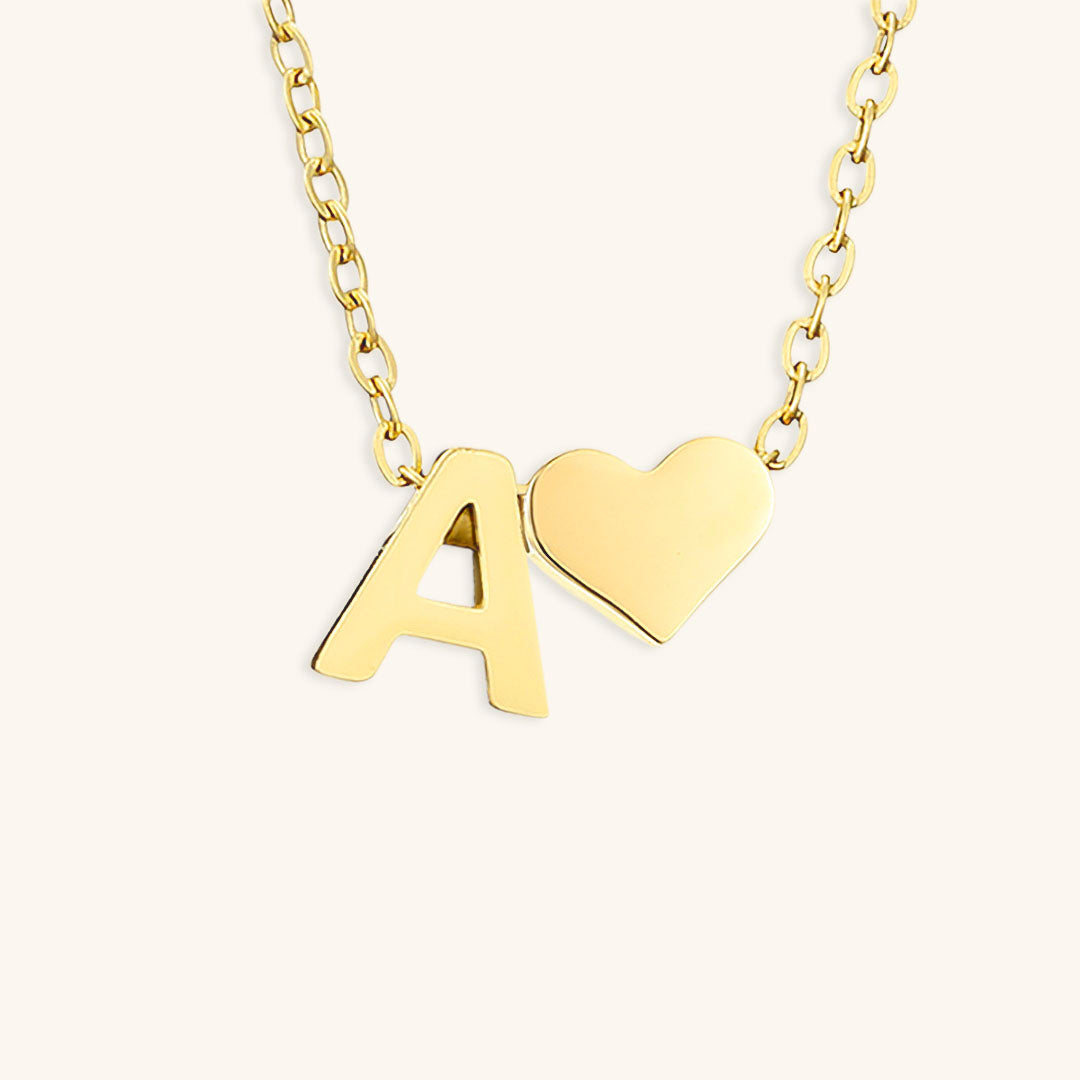 navnesmykke med initialen Ria | 18k Guld