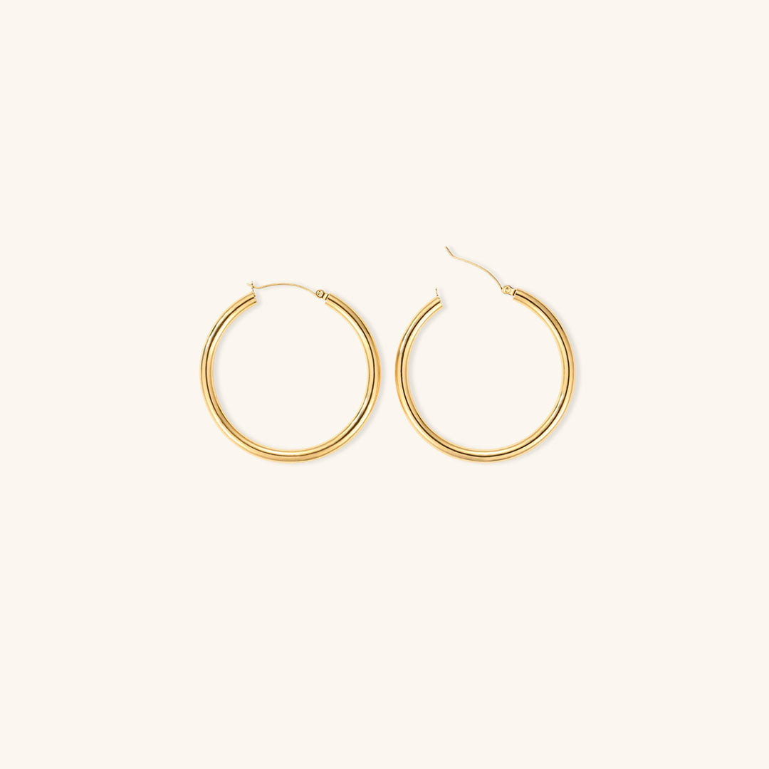 Elegante brede runde øreringe | 18k guld
