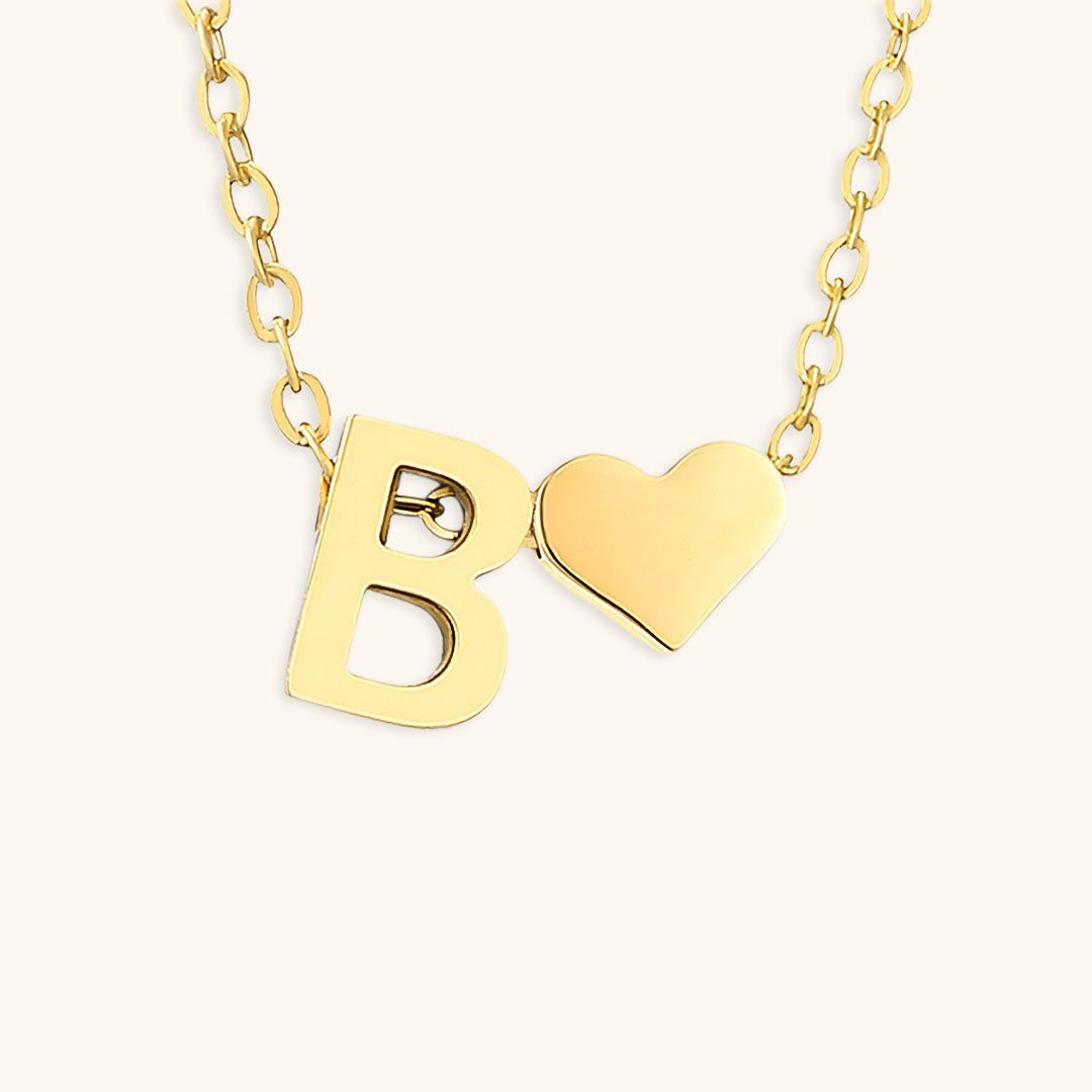navnesmykke med initialen Ria | 18k Guld