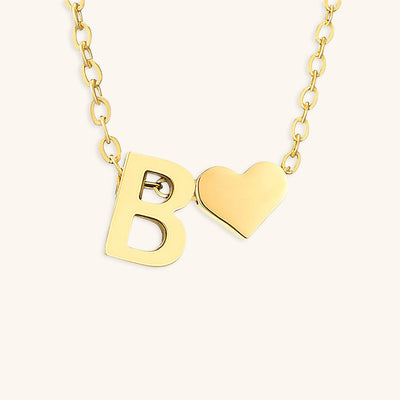 navnesmykke med initialen Ria | 18k Guld