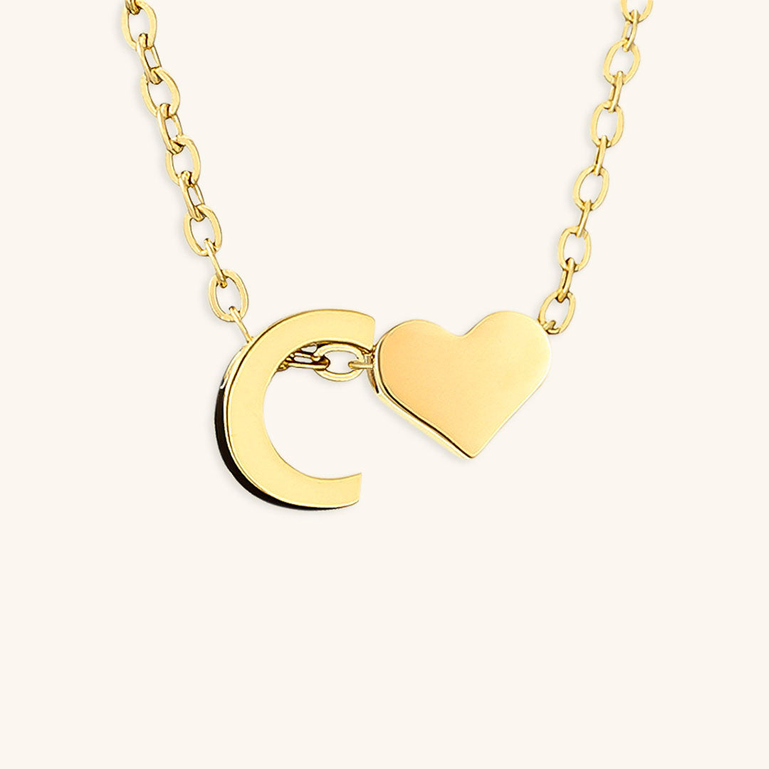 navnesmykke med initialen Ria | 18k Guld