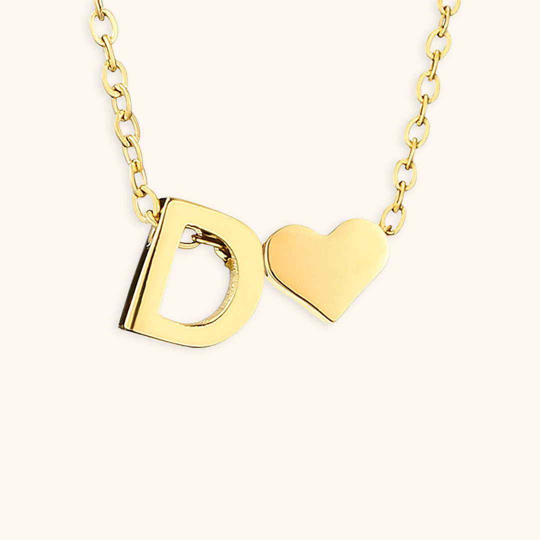 navnesmykke med initialen Ria | 18k Guld