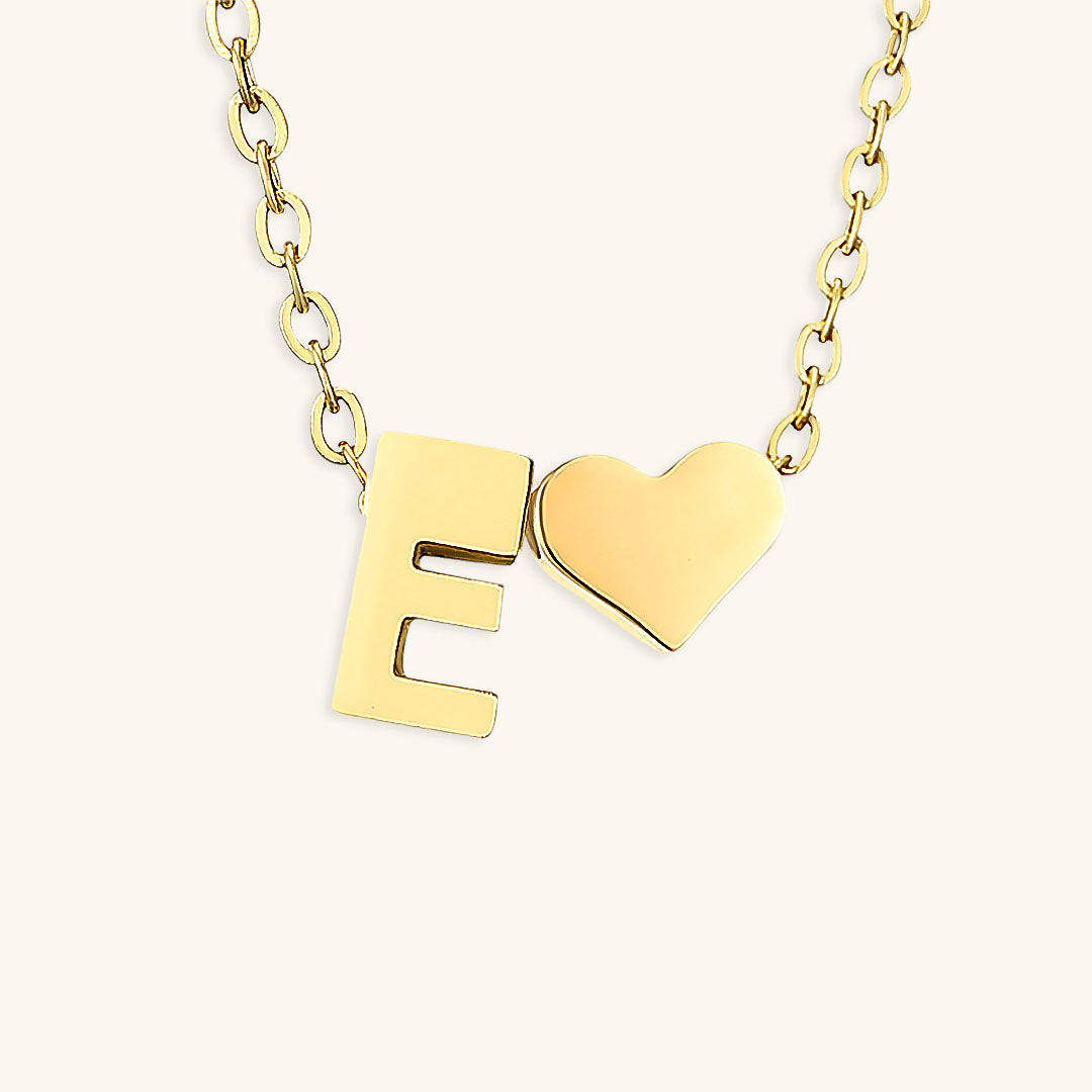 navnesmykke med initialen Ria | 18k Guld