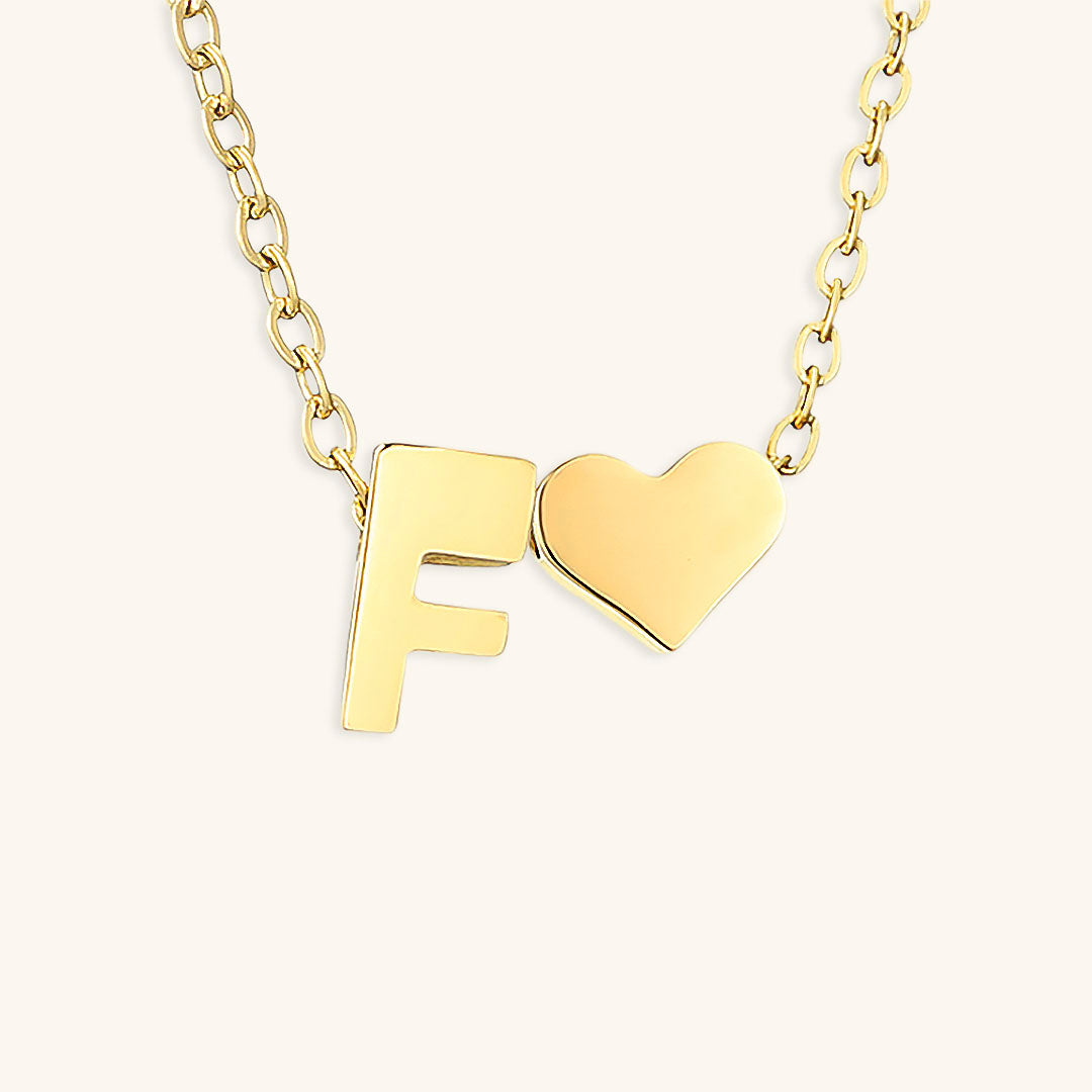 navnesmykke med initialen Ria | 18k Guld