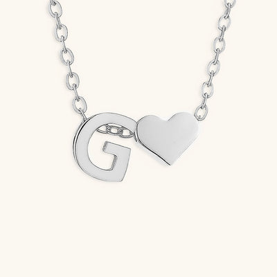 navnesmykke med initialen Ria | 18k Guld