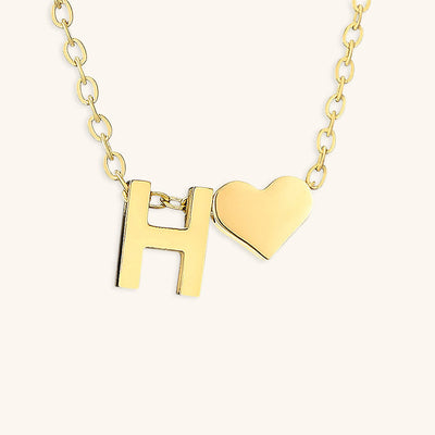navnesmykke med initialen Ria | 18k Guld