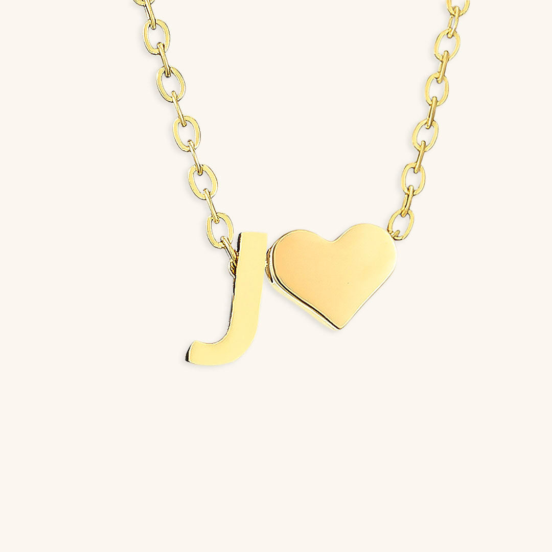 navnesmykke med initialen Ria | 18k Guld
