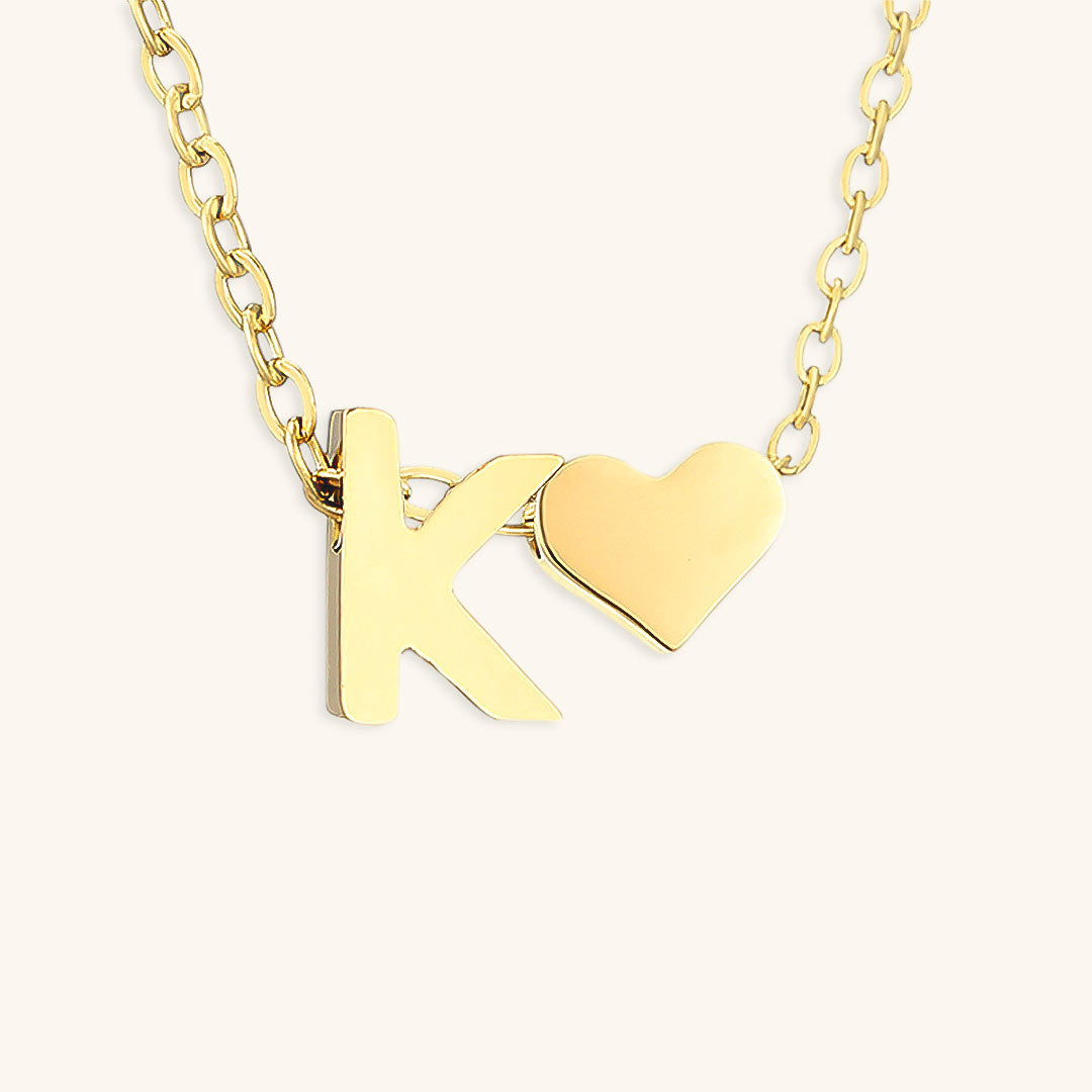 navnesmykke med initialen Ria | 18k Guld