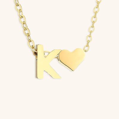 navnesmykke med initialen Ria | 18k Guld