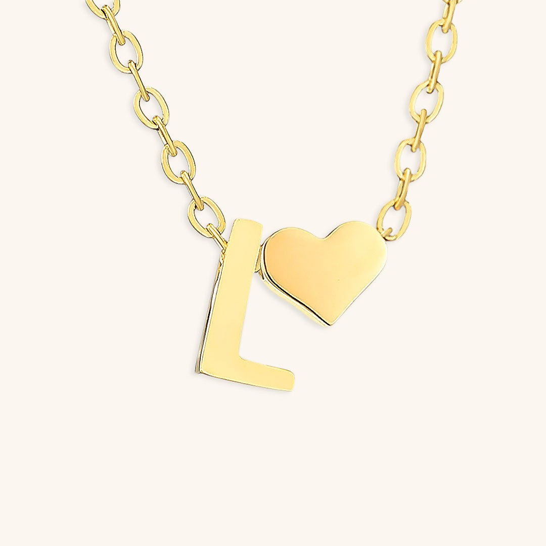 navnesmykke med initialen Ria | 18k Guld