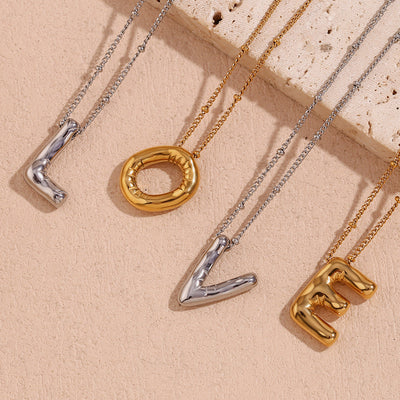 Næseørering med initialer i bobleform | Guld 18k