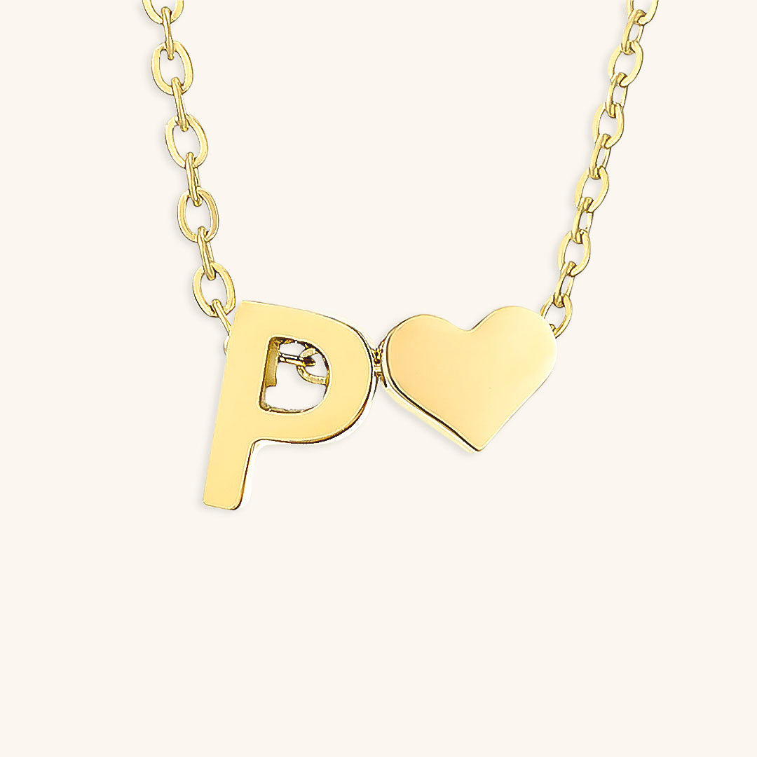 navnesmykke med initialen Ria | 18k Guld