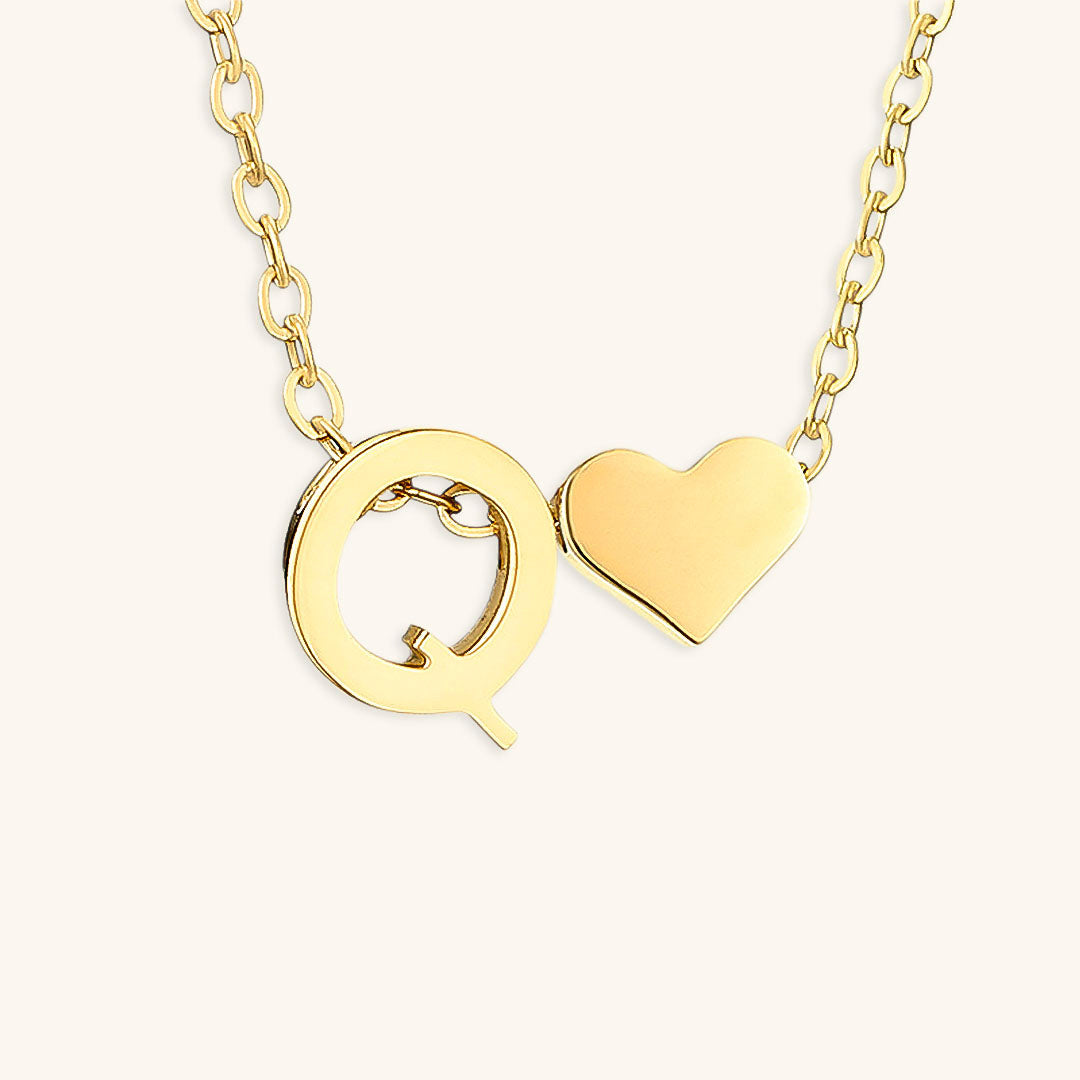 navnesmykke med initialen Ria | 18k Guld