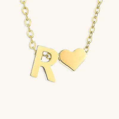 navnesmykke med initialen Ria | 18k Guld