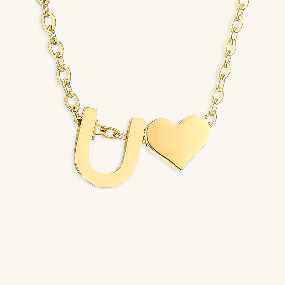 navnesmykke med initialen Ria | 18k Guld