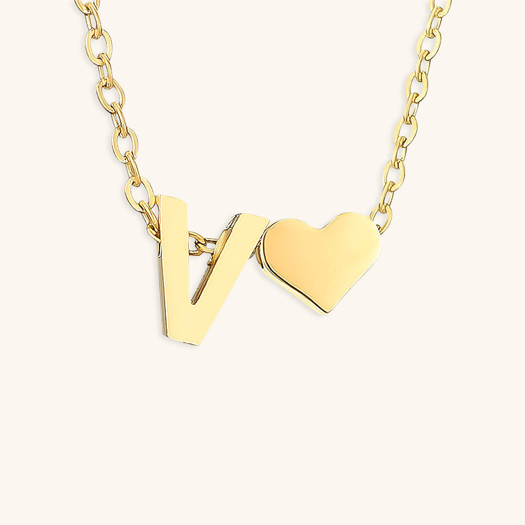 navnesmykke med initialen Ria | 18k Guld