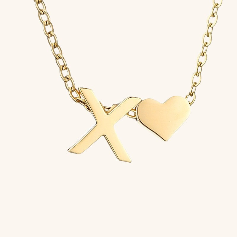 navnesmykke med initialen Ria | 18k Guld
