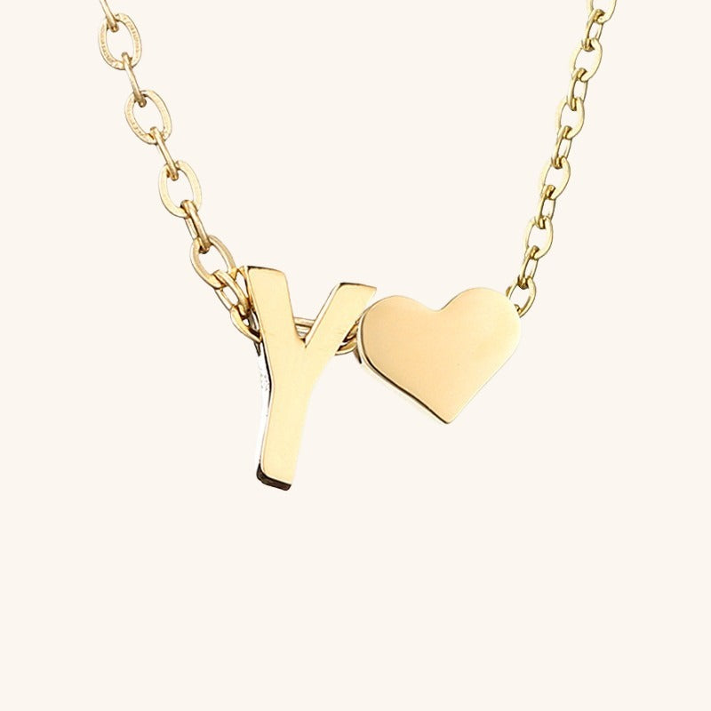 navnesmykke med initialen Ria | 18k Guld