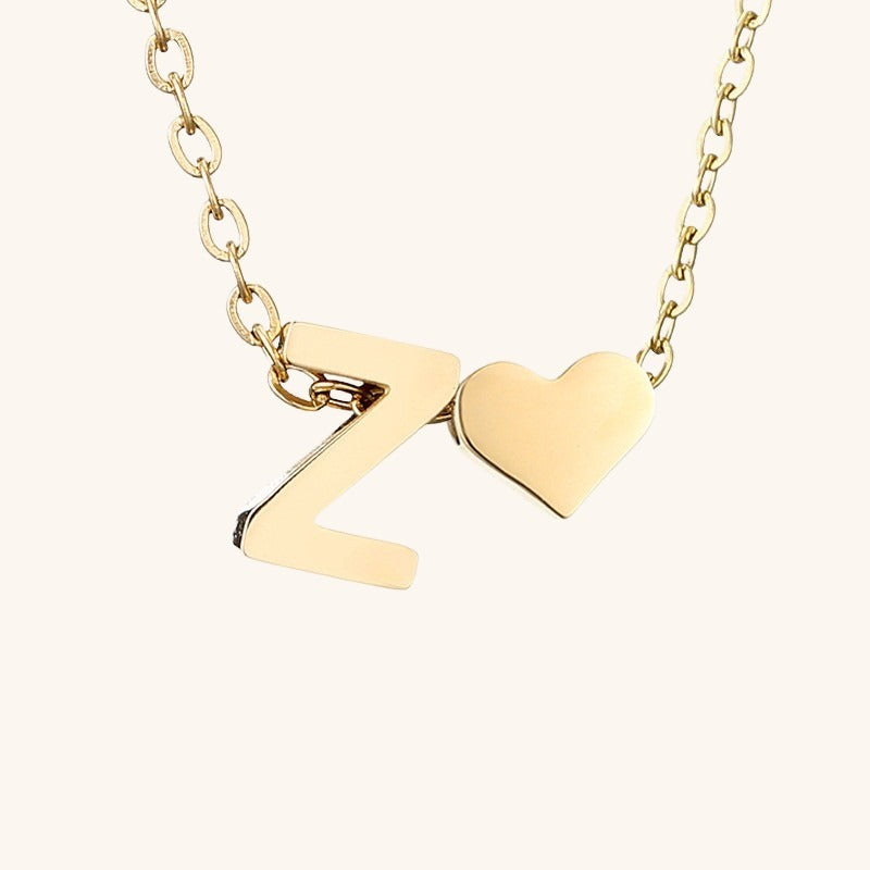 navnesmykke med initialen Ria | 18k Guld