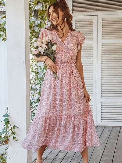 Lyserød elegant kjole med blomster